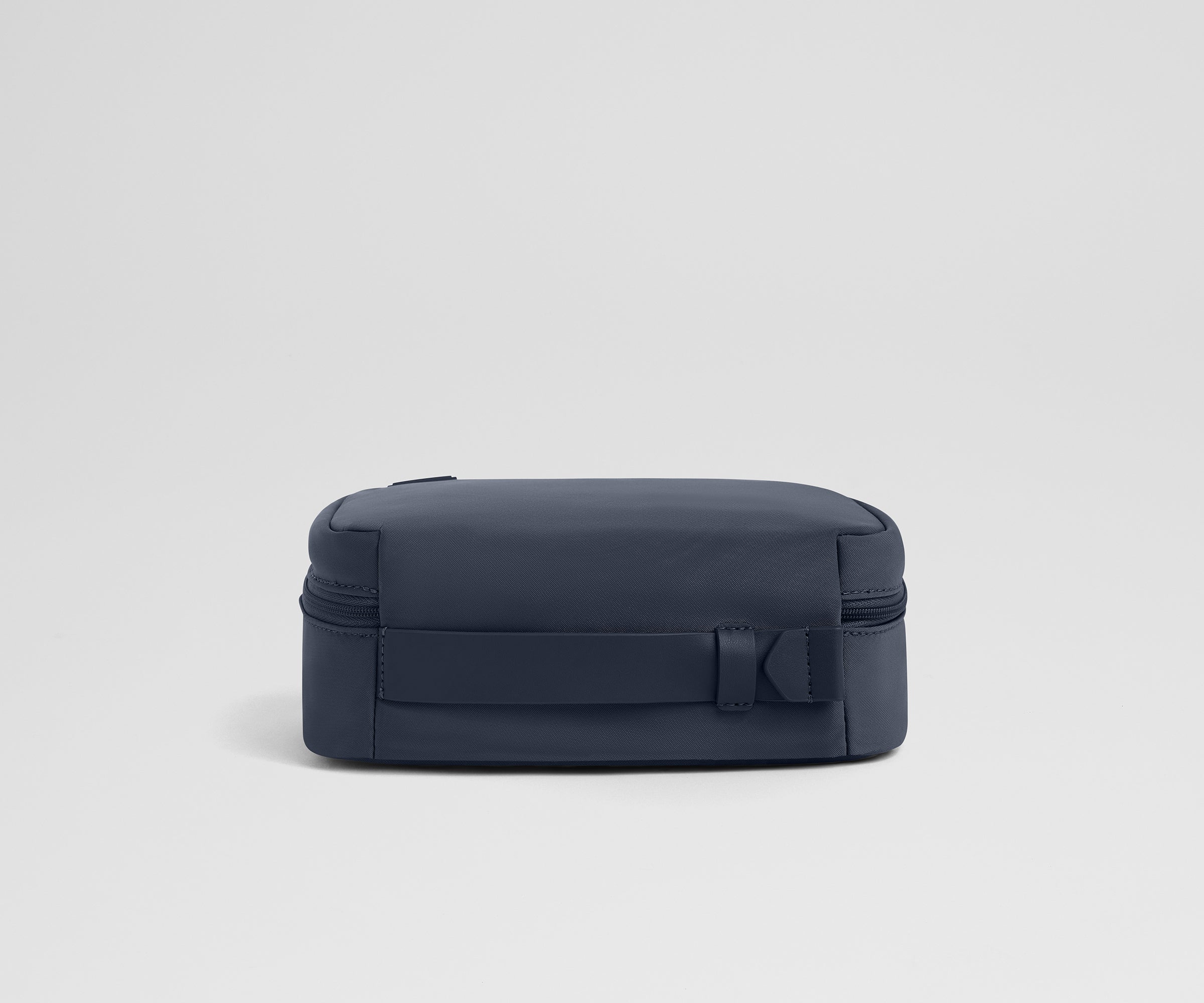 PDP_ToiletryBag_Small_Navy_04_ac4d6809-ad1a-49df-a94f-6b945303e001.jpg